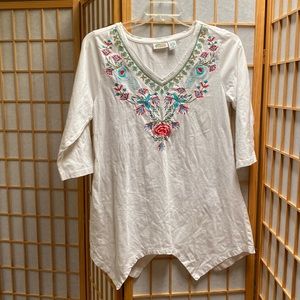 Half sleeve white top with floral embroidery on neckline